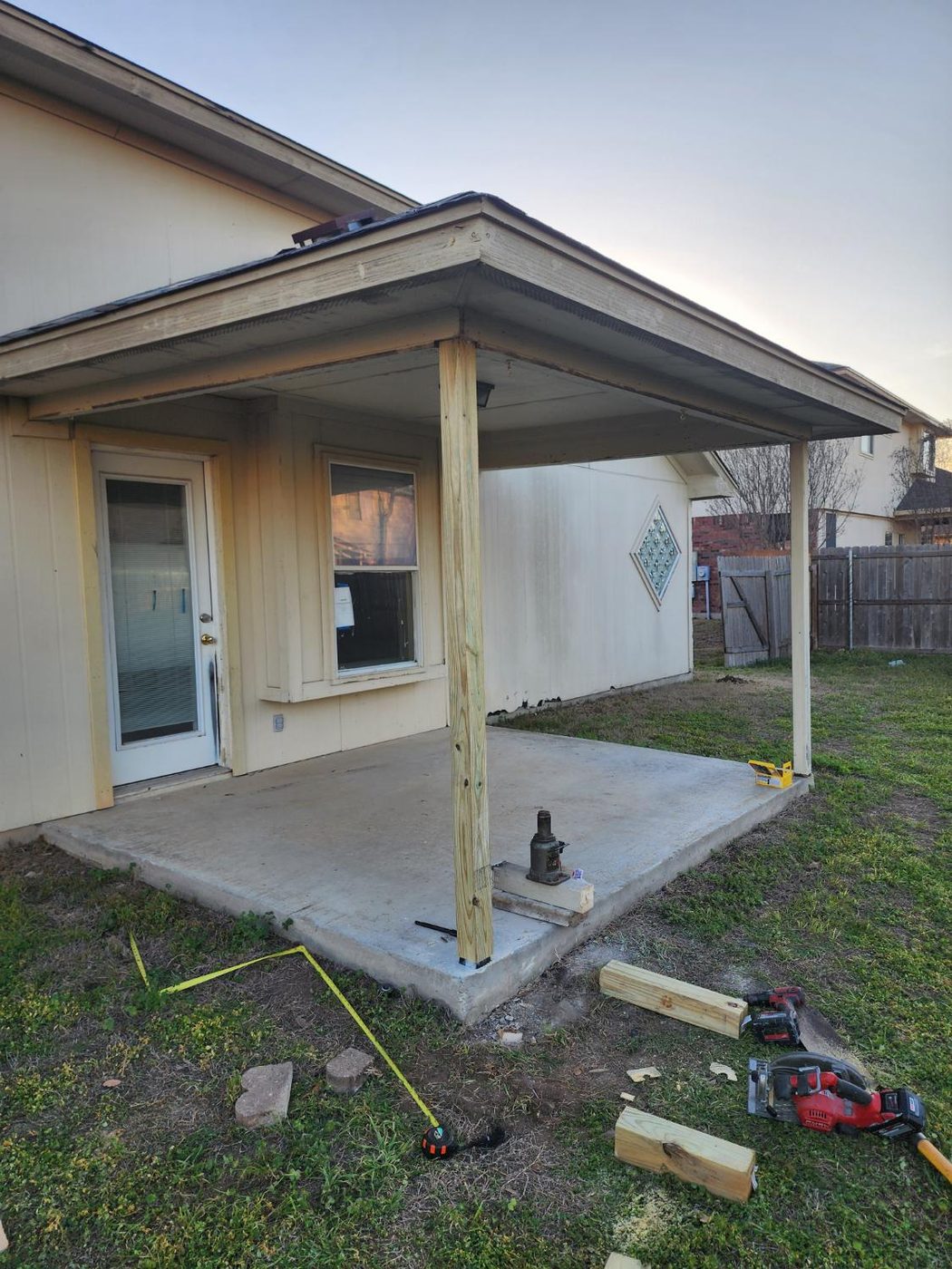 New treated post under a patio cover